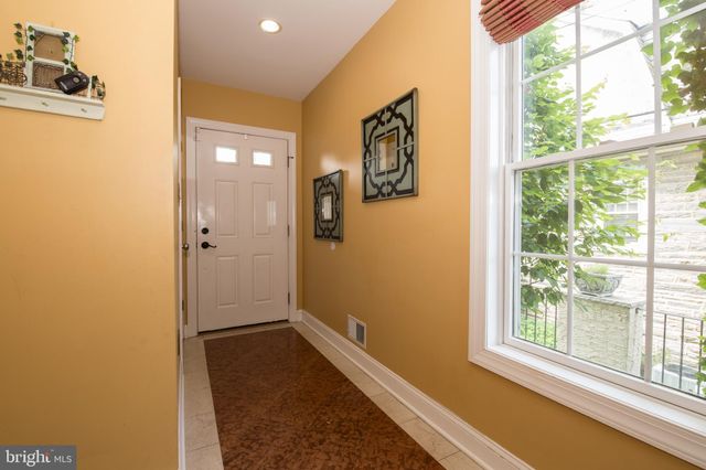 a bathroom with a tub and shower