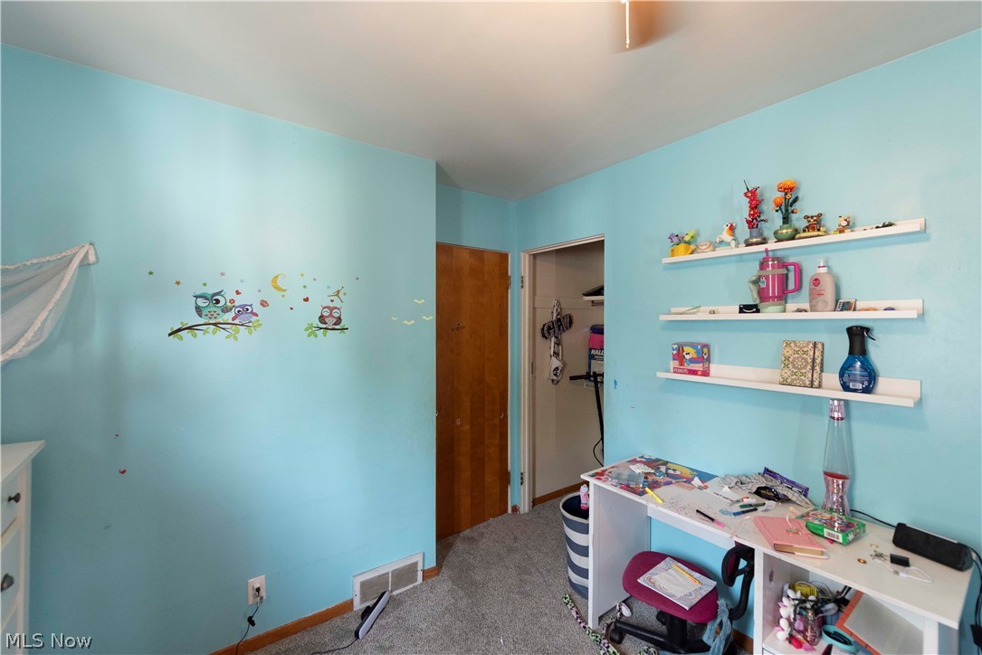 400 Baldwin Road Akron, OH 44312 - Photo 24 of 43 Bedroom 3 with shelving on wall and more fun decor.