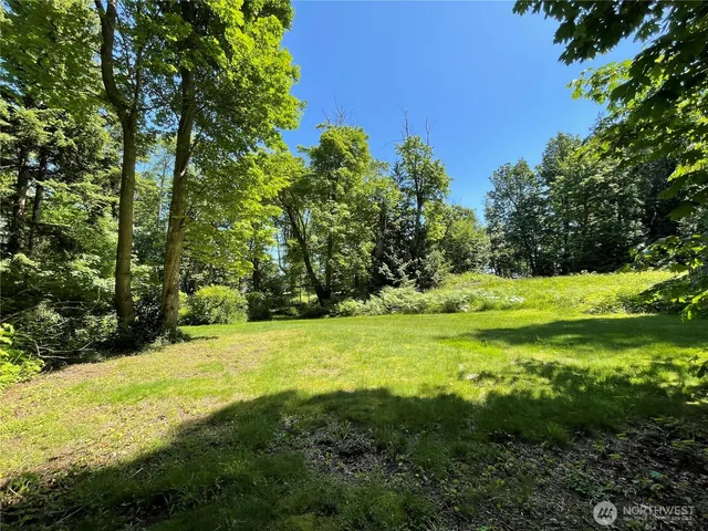 a view of a house with a backyard space