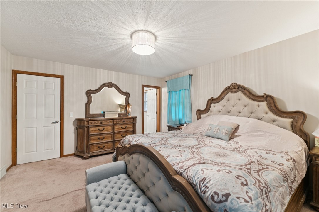 6930 Firestone Road Northeast Canton, OH 44721 - Photo 21 of 49 Bedroom with light carpet