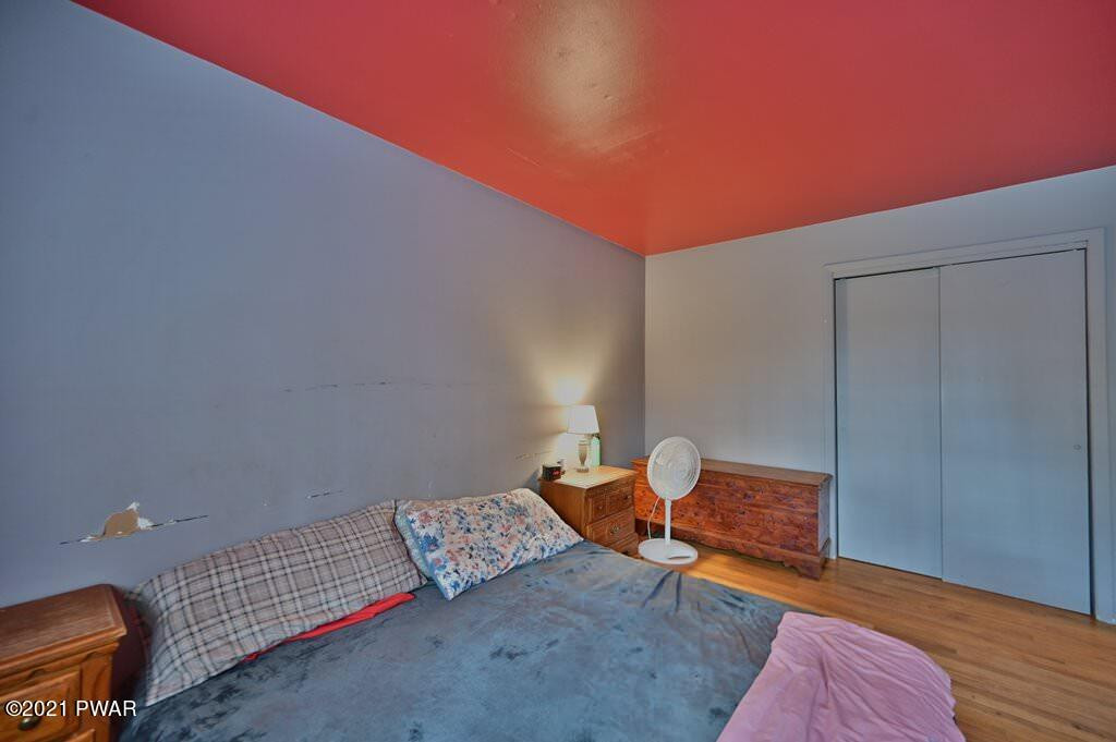127 Estates Road Greentown, PA 18426 - Photo 19 of 85 a bedroom with a bed and wooden floor