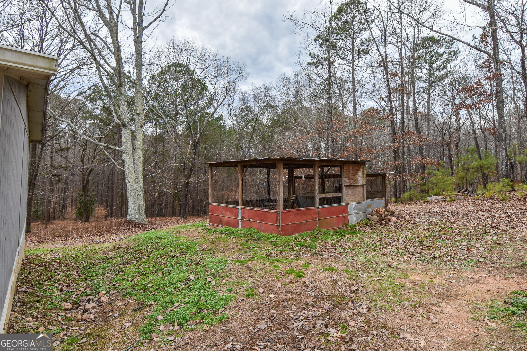 18 Ridgecrest Drive Thomaston, GA 30286 - Photo 13 of 53 a view of a house with backyard and trees