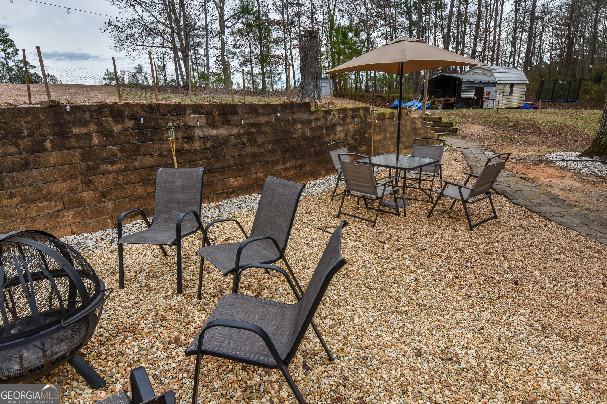 18 Ridgecrest Drive Thomaston, GA 30286 - Photo 15 of 53 a patio with tables and chairs