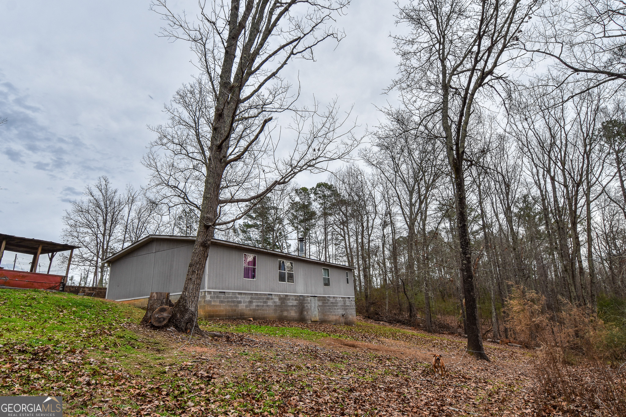 18 Ridgecrest Drive Thomaston, GA 30286 - Photo 23 of 53 a view of a house with a large tree and a big yard