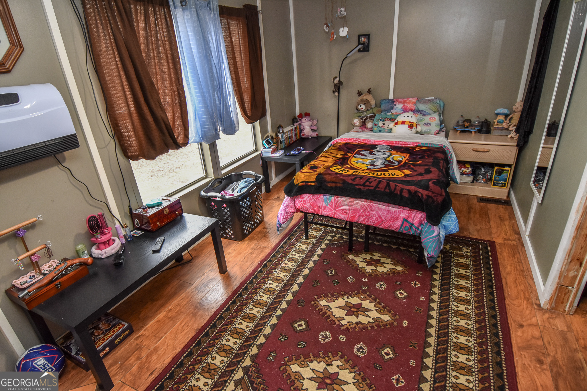 18 Ridgecrest Drive Thomaston, GA 30286 - Photo 45 of 53 a bedroom with a bed next to a small yard