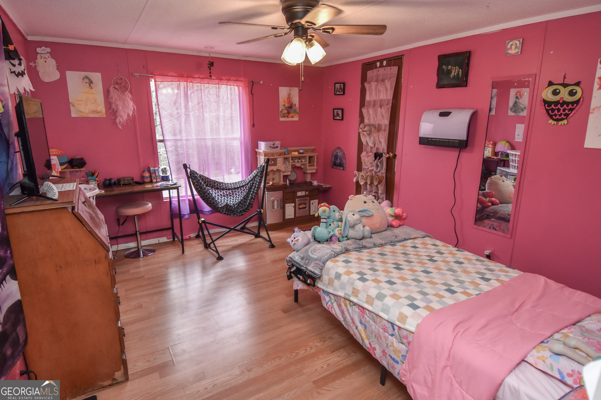 18 Ridgecrest Drive Thomaston, GA 30286 - Photo 46 of 53 a bedroom with bed and a chandelier