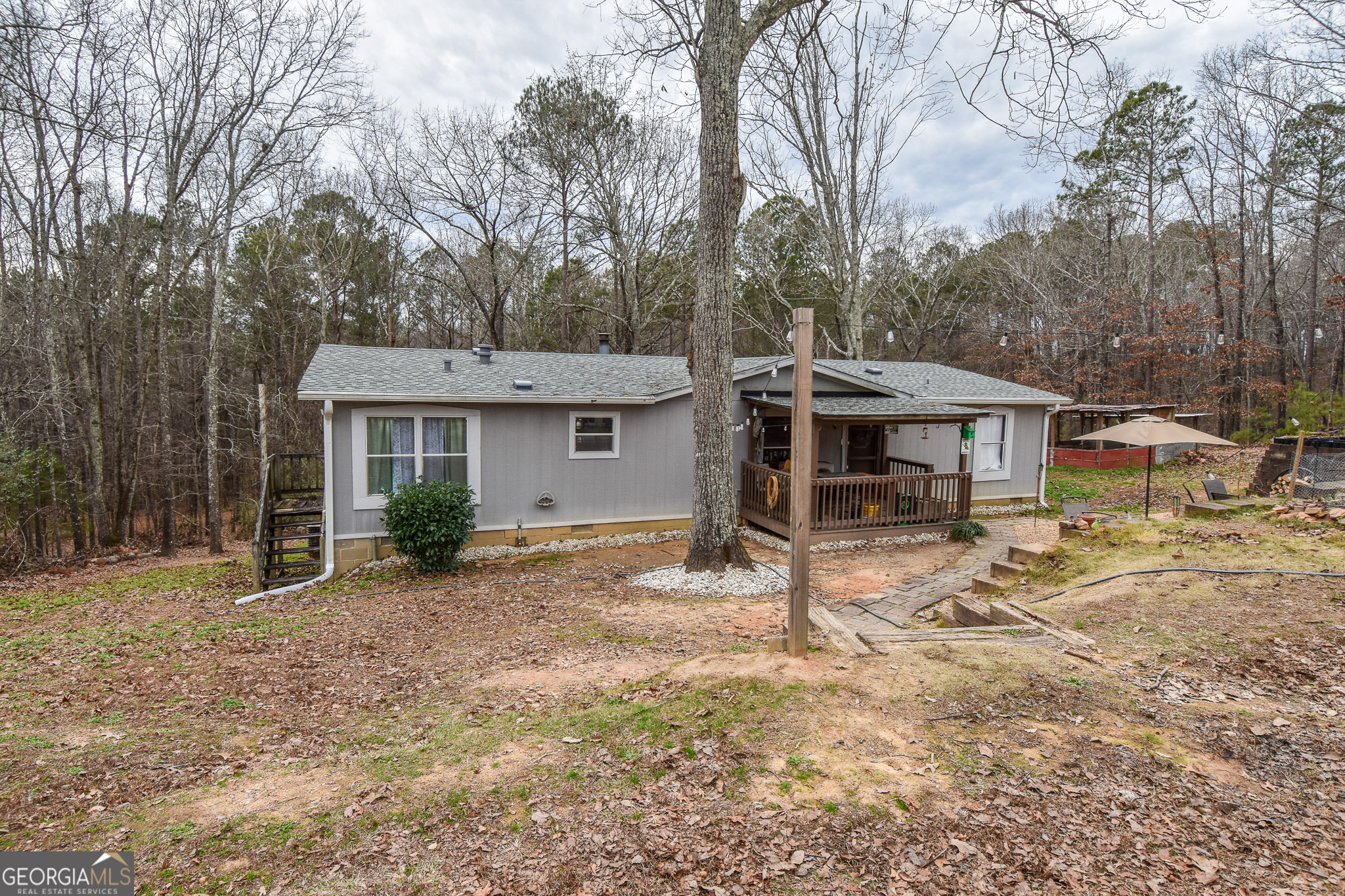 18 Ridgecrest Drive Thomaston, GA 30286 - Photo 9 of 53 a view of a house with backyard and chairs