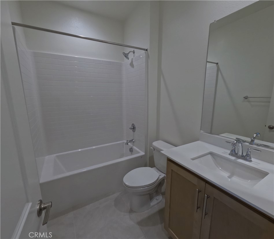 32336 Brunello Way Temecula, CA 92591 - Photo 12 of 25 a bathroom with a sink a toilet and shower