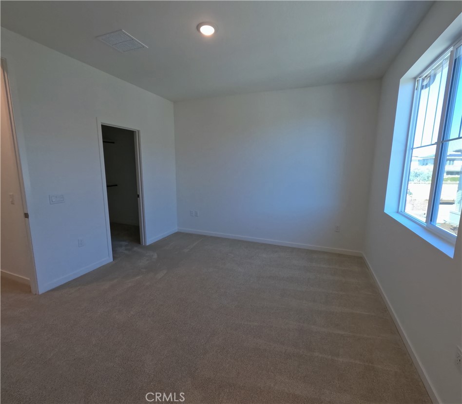 32336 Brunello Way Temecula, CA 92591 - Photo 14 of 25 an empty room with windows