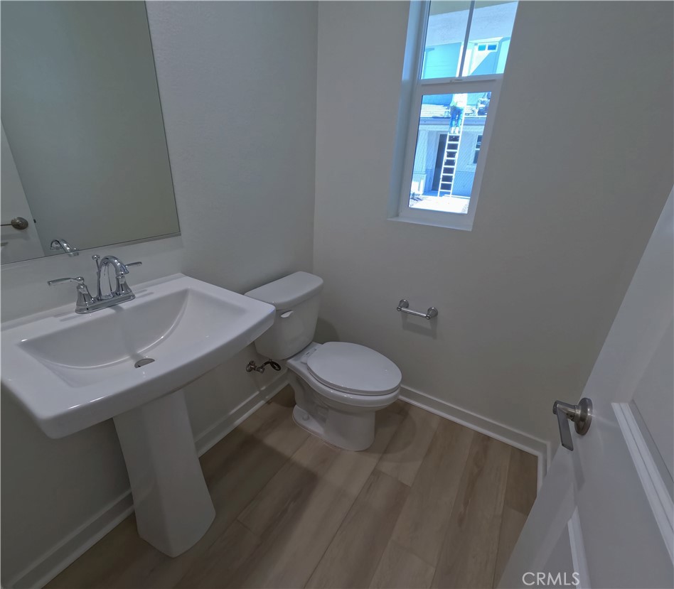 32336 Brunello Way Temecula, CA 92591 - Photo 7 of 25 a bathroom with a sink toilet and window