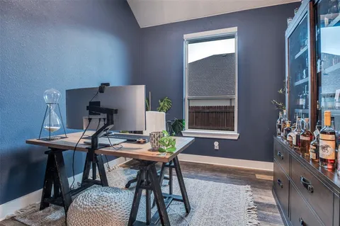 a workspace with furniture and window