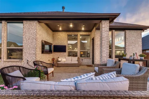 a living room with furniture and flat screen tv