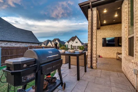 a living room with furniture and flat screen tv
