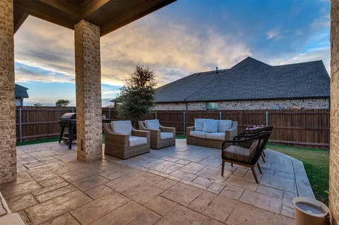 a backyard of a house with seating space