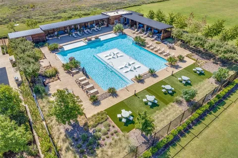 a view of a balcony with wooden floor