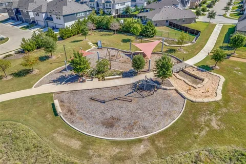 an aerial view of a house with outdoor space