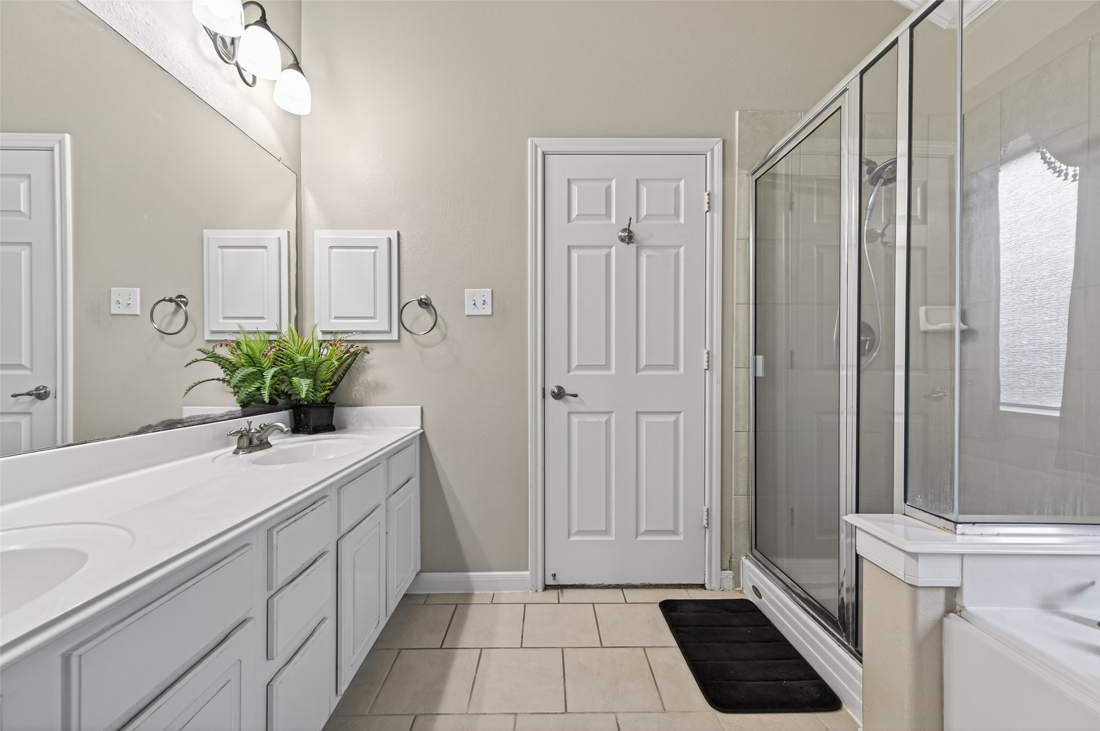4602 Countrypines Drive Spring, TX 77388 - Photo 11 of 21 a bathroom with a sink a mirror and a shower