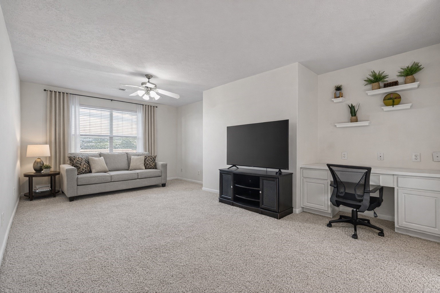 4602 Countrypines Drive Spring, TX 77388 - Photo 13 of 21 a living room with furniture and a flat screen tv