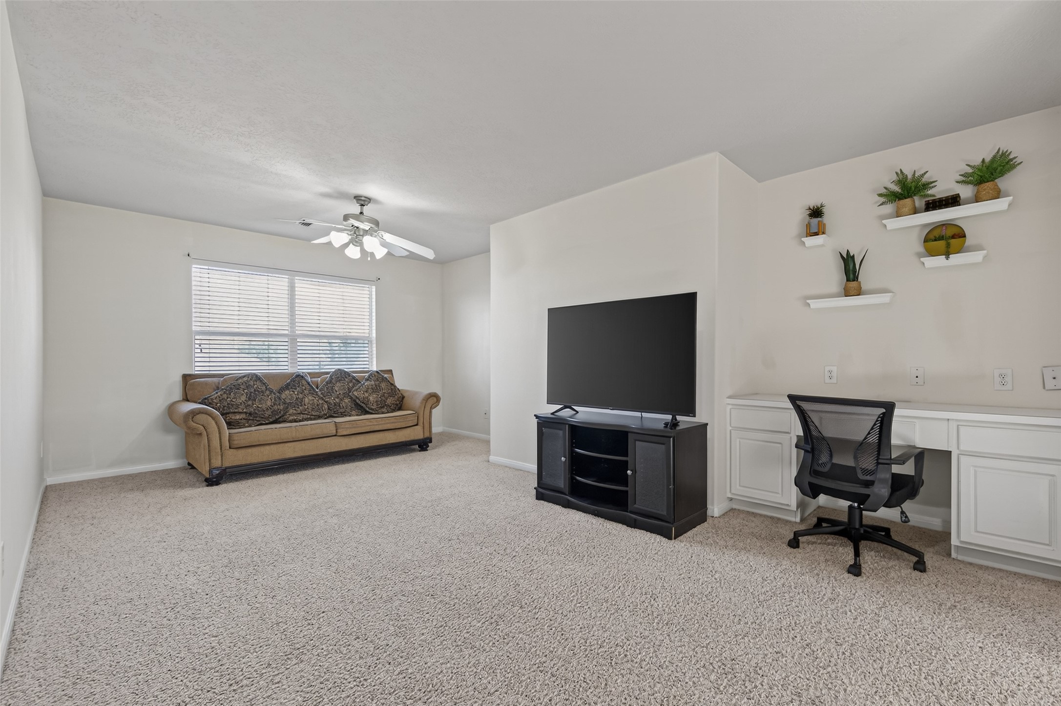 4602 Countrypines Drive Spring, TX 77388 - Photo 14 of 21 a living room with furniture and a flat screen tv