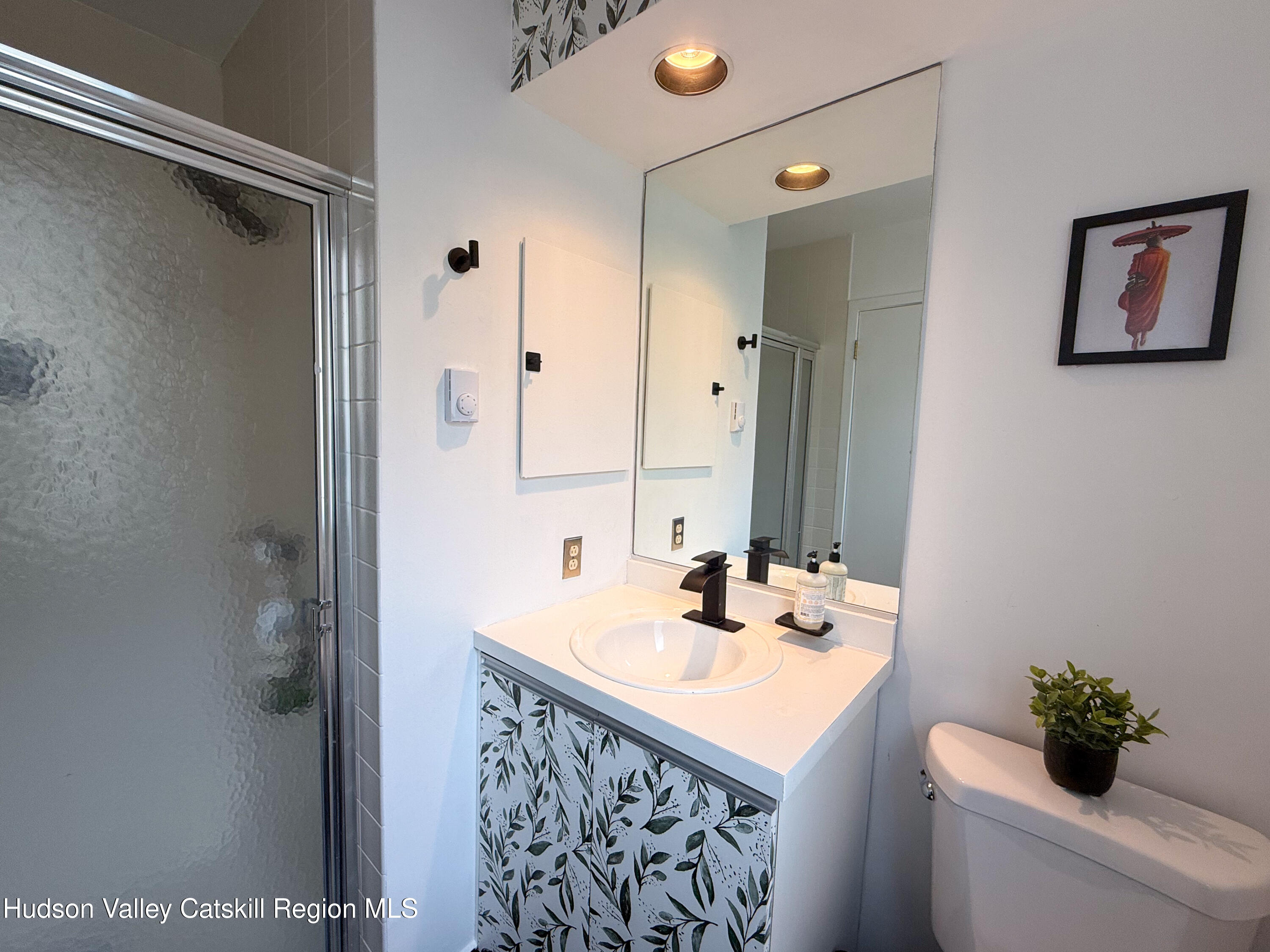 130 Pines Drive, Unit 59 Roxbury, NY 12421 - Photo 20 of 34 a bathroom with a sink and a mirror