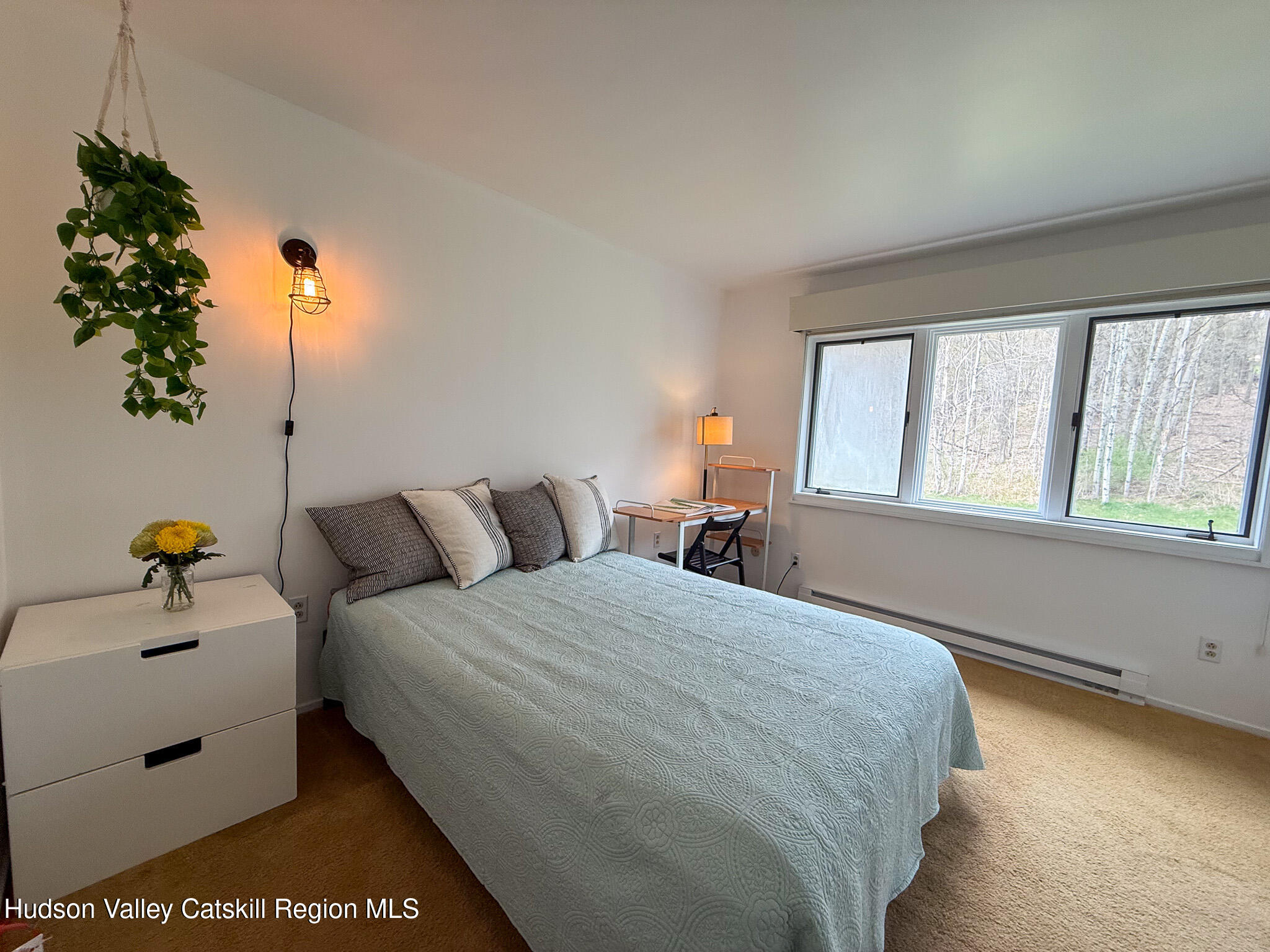 130 Pines Drive, Unit 59 Roxbury, NY 12421 - Photo 23 of 34 a bedroom with bed and window