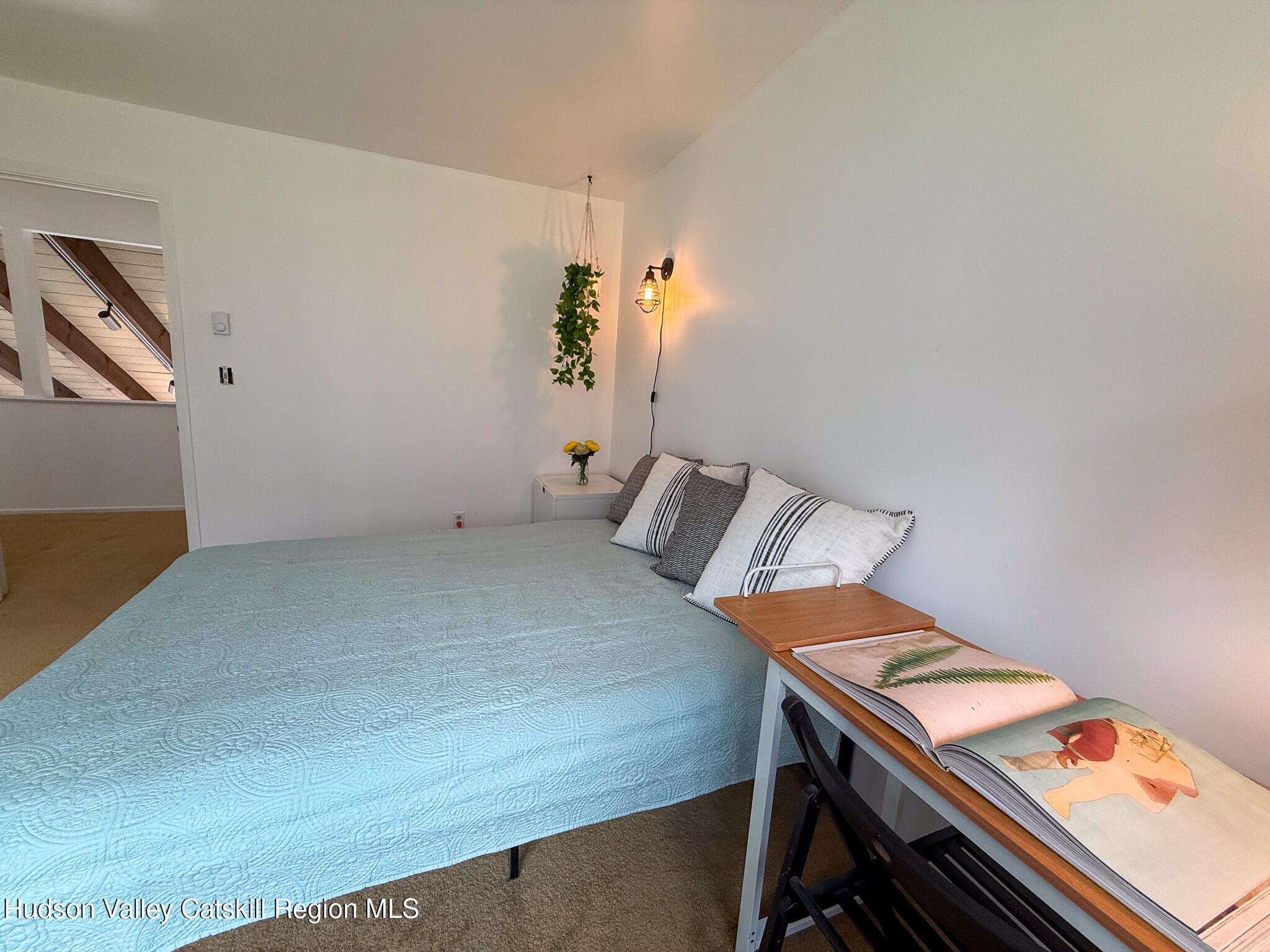 130 Pines Drive, Unit 59 Roxbury, NY 12421 - Photo 24 of 34 a bedroom with a bed and a dresser