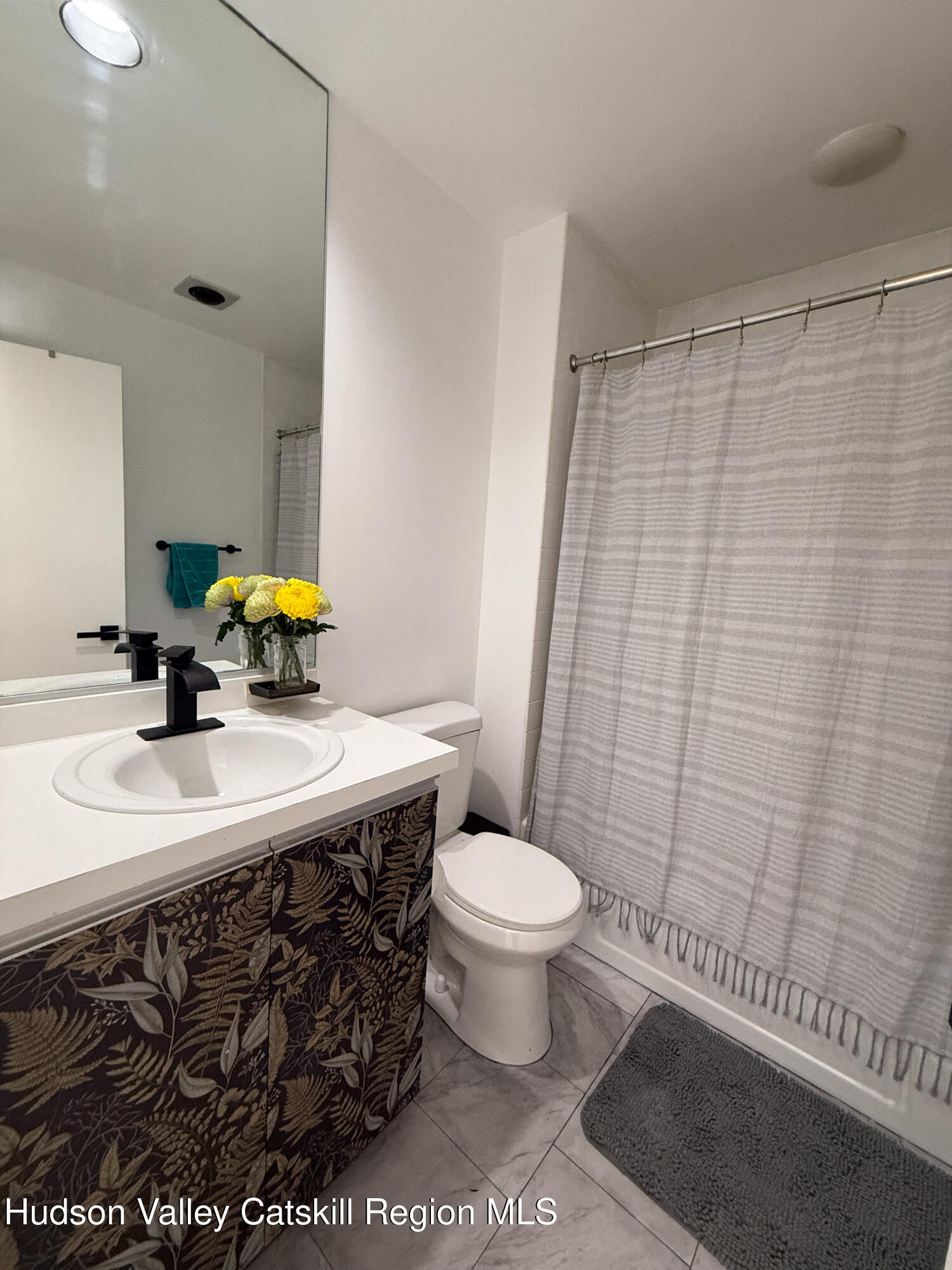 130 Pines Drive, Unit 59 Roxbury, NY 12421 - Photo 26 of 34 a bathroom with a sink toilet and shower