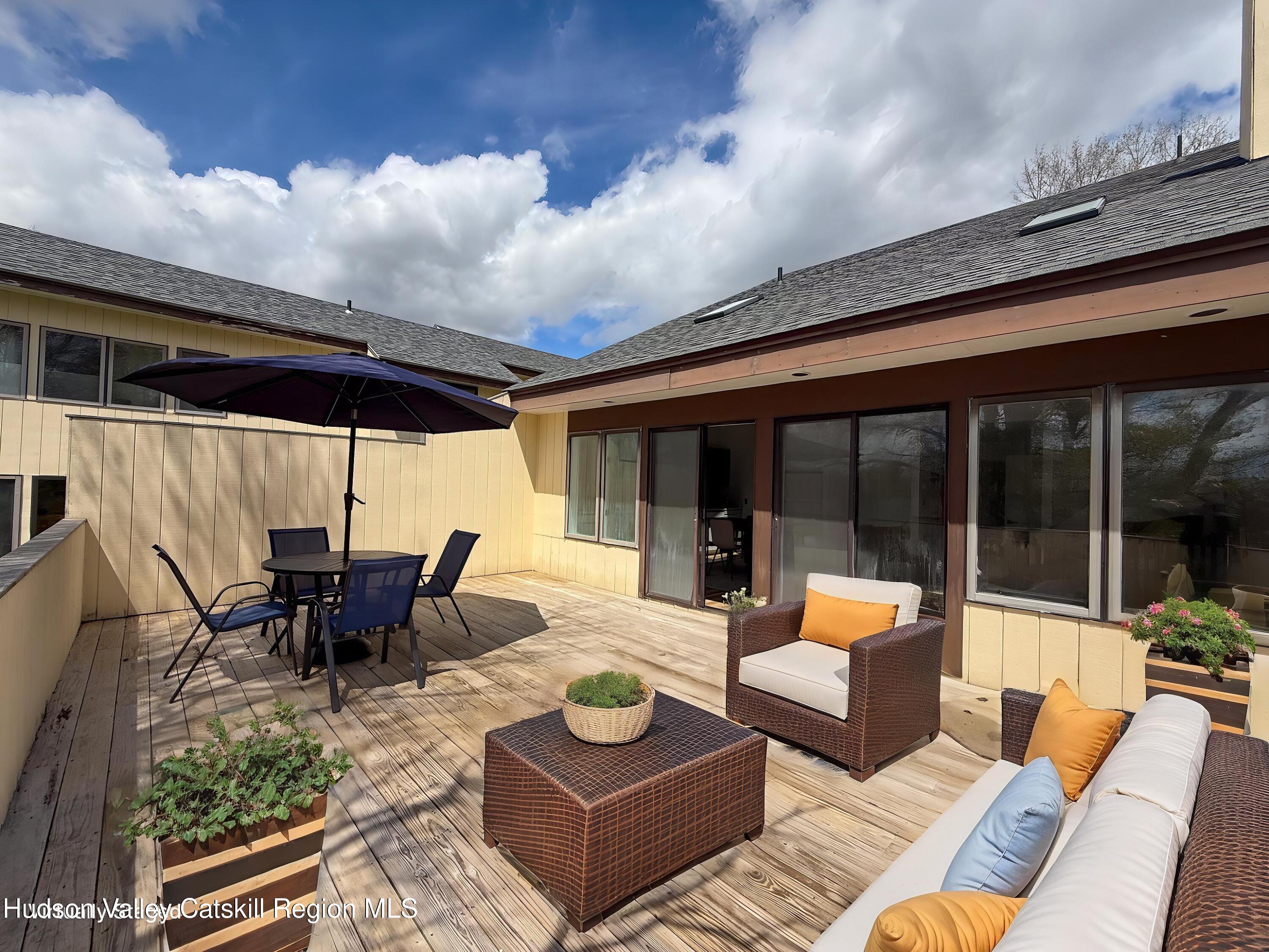 130 Pines Drive, Unit 59 Roxbury, NY 12421 - Photo 3 of 34 a outdoor living space with furniture and garden view