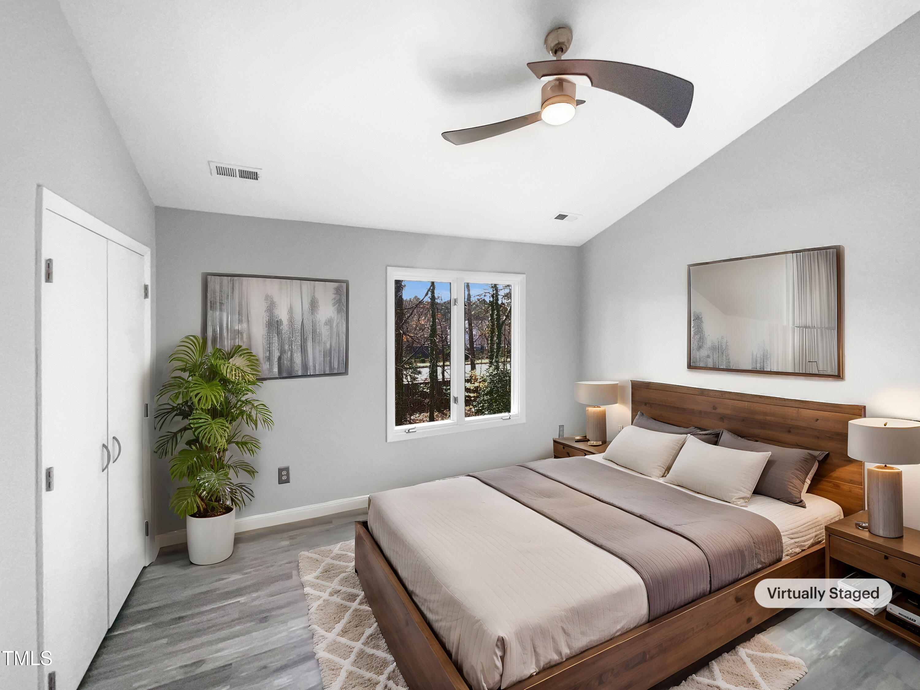 4213 Sunscape Lane Raleigh, NC 27613 - Photo 4 of 19 a bedroom with a large bed and a window