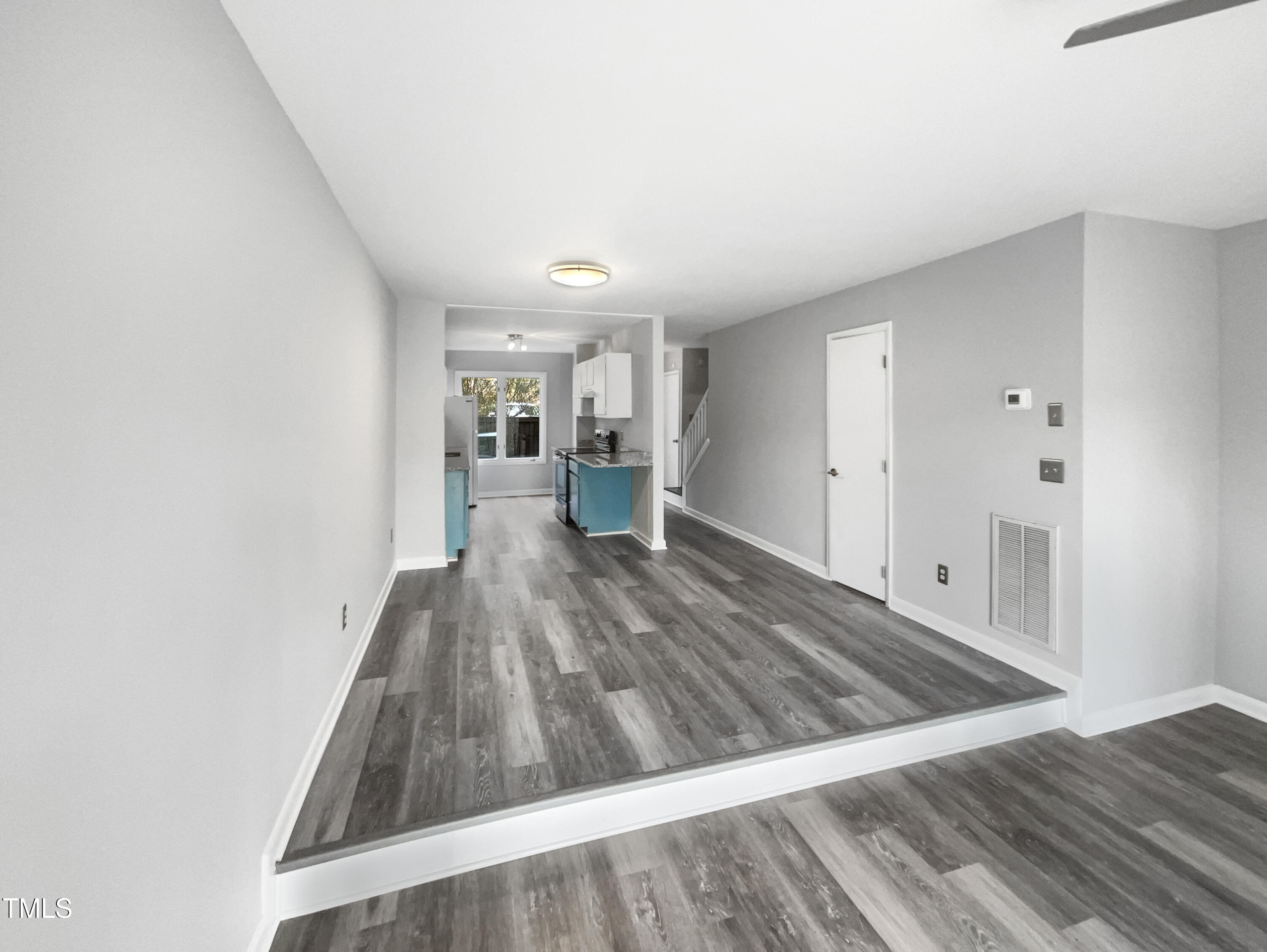 4213 Sunscape Lane Raleigh, NC 27613 - Photo 9 of 19 a view of a living room with wooden floor