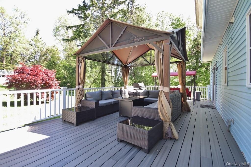 30 Granite Springs Road Granite Springs, NY 10527 - Photo 27 of 37 a view of a patio with couches potted plants and wooden floor