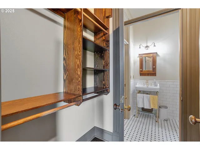 a living room with a bed and furniture