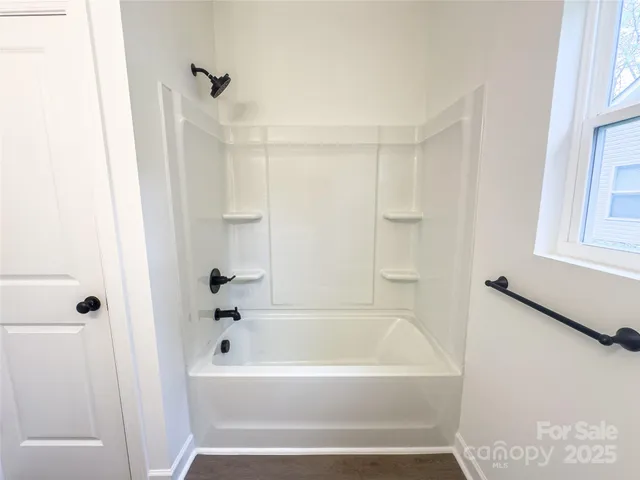 a bathroom with a sink vanity and a mirror