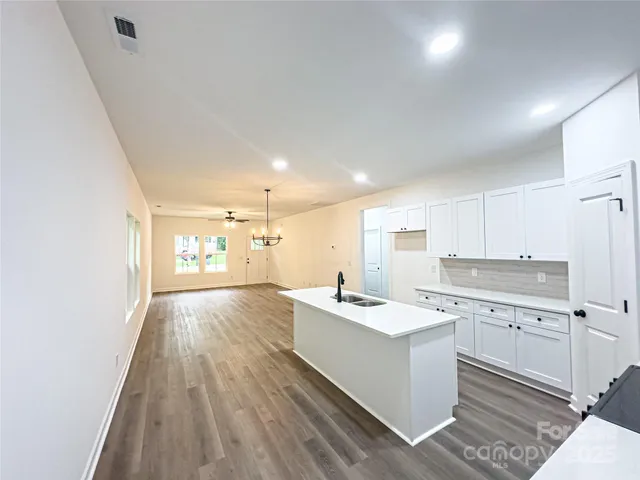 a view of kitchen with wooden floor