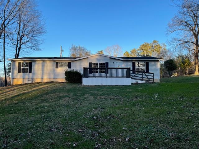 2740 Rutrough Road Southeast Roanoke, VA 24014 - Photo 1 of 27 a front view of a house with a garden and outdoor seating