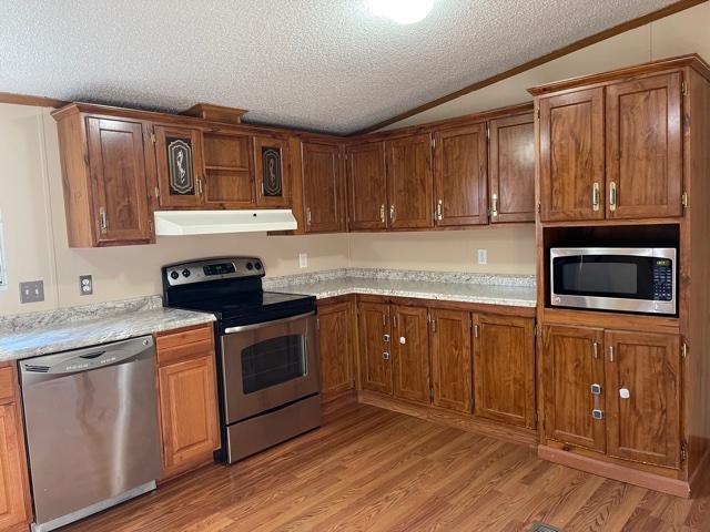 2740 Rutrough Road Southeast Roanoke, VA 24014 - Photo 15 of 27 a kitchen with stainless steel appliances granite countertop a stove a sink and a microwave