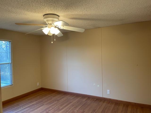 2740 Rutrough Road Southeast Roanoke, VA 24014 - Photo 20 of 27 a view of a chandelier fan and hardwood floor