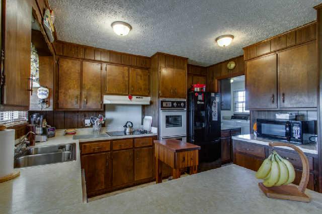 1035 Mill Road Dickson, TN 37055 - Photo 9 of 20 This wonderful kitchen is a pleasure to spend time in. Great layout, plenty of cabinet space, double ovens, and storage nearby!