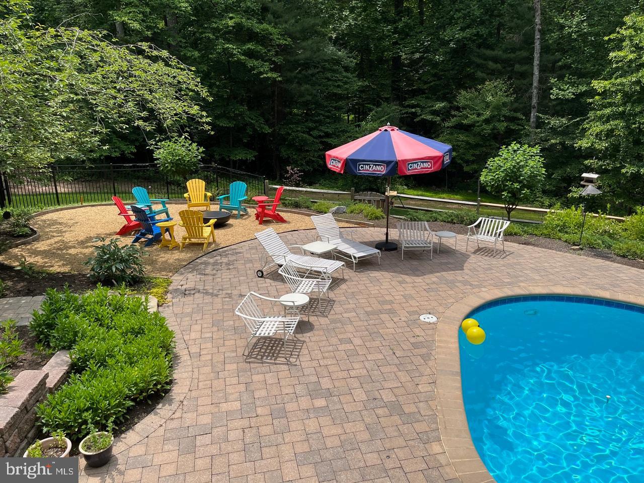 10912 Justin Knoll Road Oakton, VA 22124 - Photo 4 of 6 Large paver area around pool for relaxing