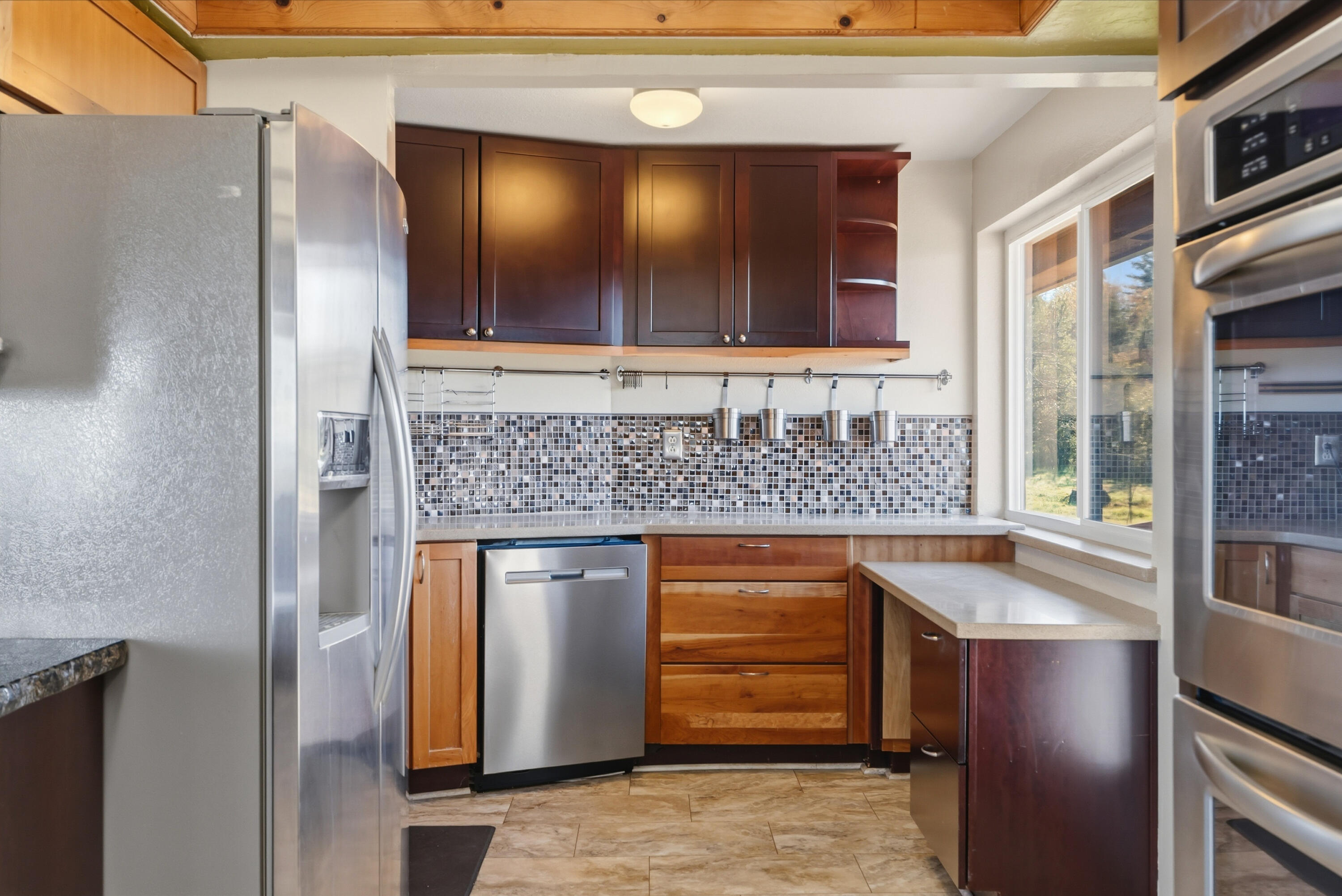 6866 Alpine Ridge Road Shingletown, CA 96088 - Photo 14 of 58 a kitchen with stainless steel appliances granite countertop a sink and a refrigerator