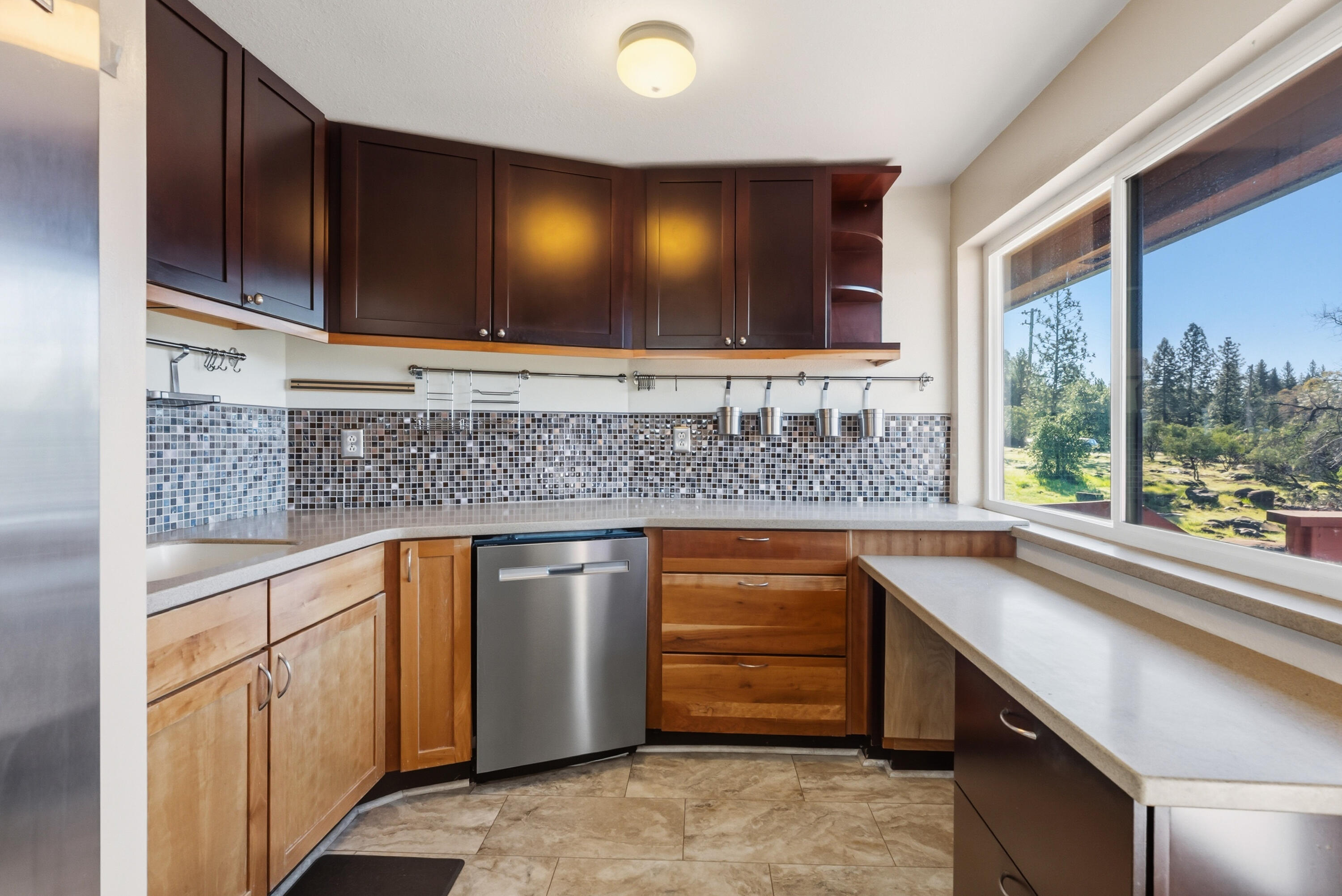 6866 Alpine Ridge Road Shingletown, CA 96088 - Photo 15 of 58 a kitchen with stainless steel appliances granite countertop a sink stove and cabinets