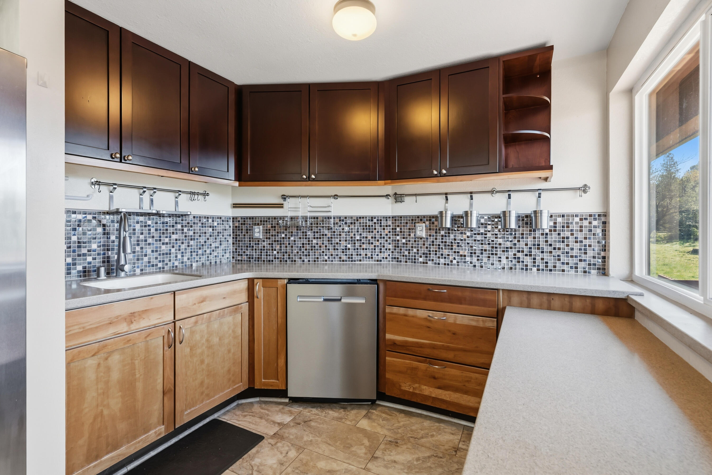 6866 Alpine Ridge Road Shingletown, CA 96088 - Photo 16 of 58 a kitchen with stainless steel appliances granite countertop wooden cabinets a sink and dishwasher