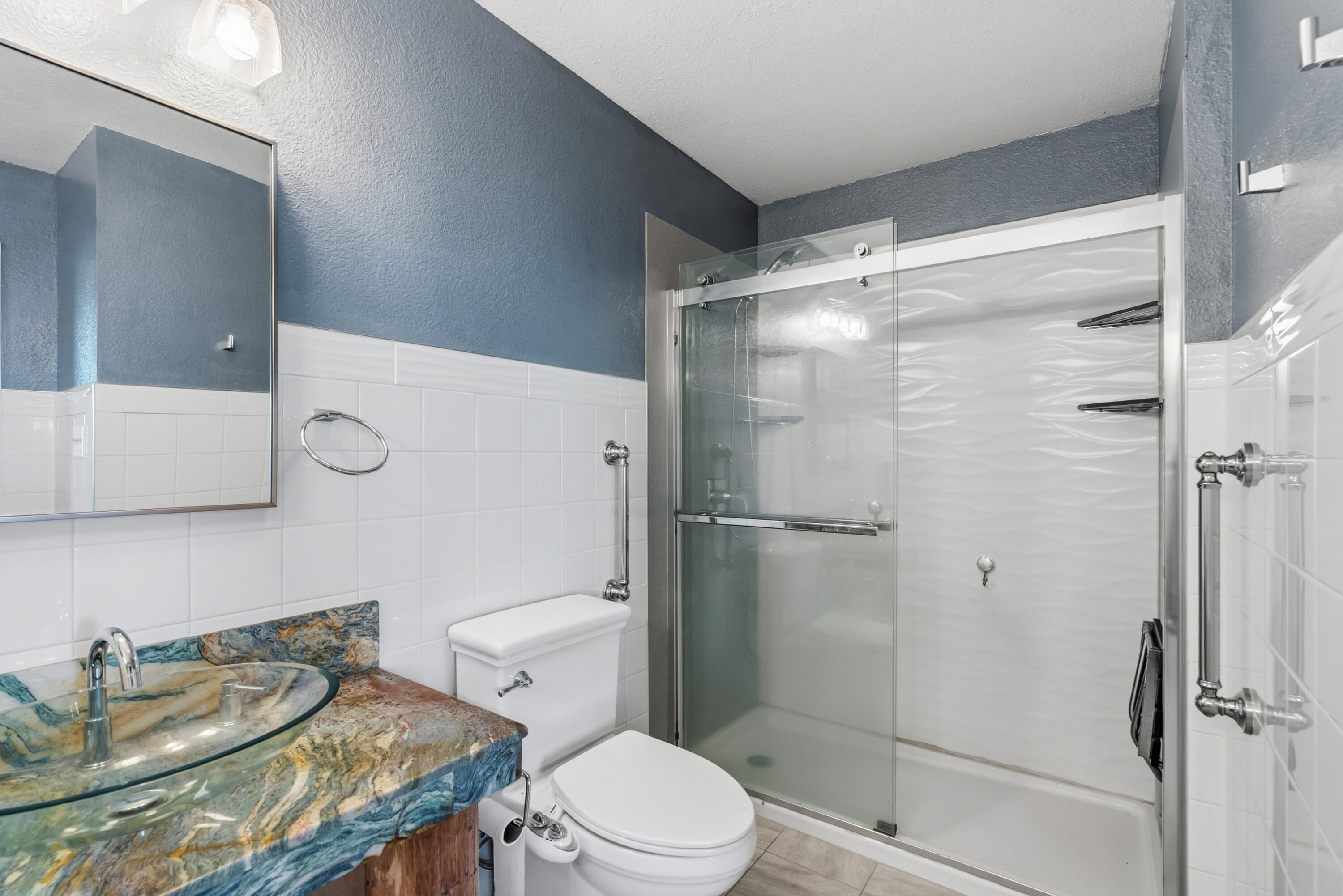 6866 Alpine Ridge Road Shingletown, CA 96088 - Photo 26 of 58 a bathroom with a sink toilet and shower