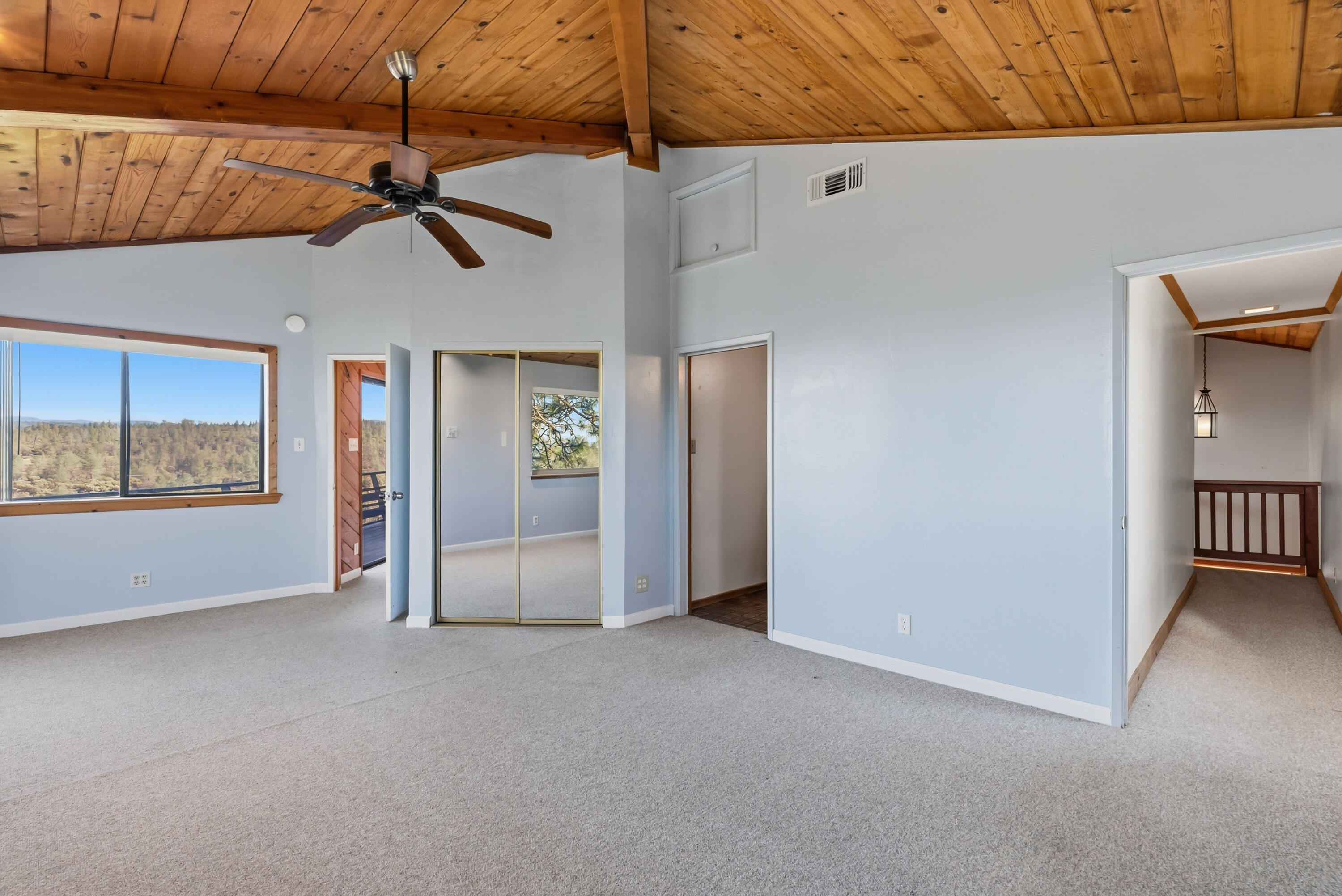 6866 Alpine Ridge Road Shingletown, CA 96088 - Photo 33 of 58 a view of a livingroom with a ceiling fan and window