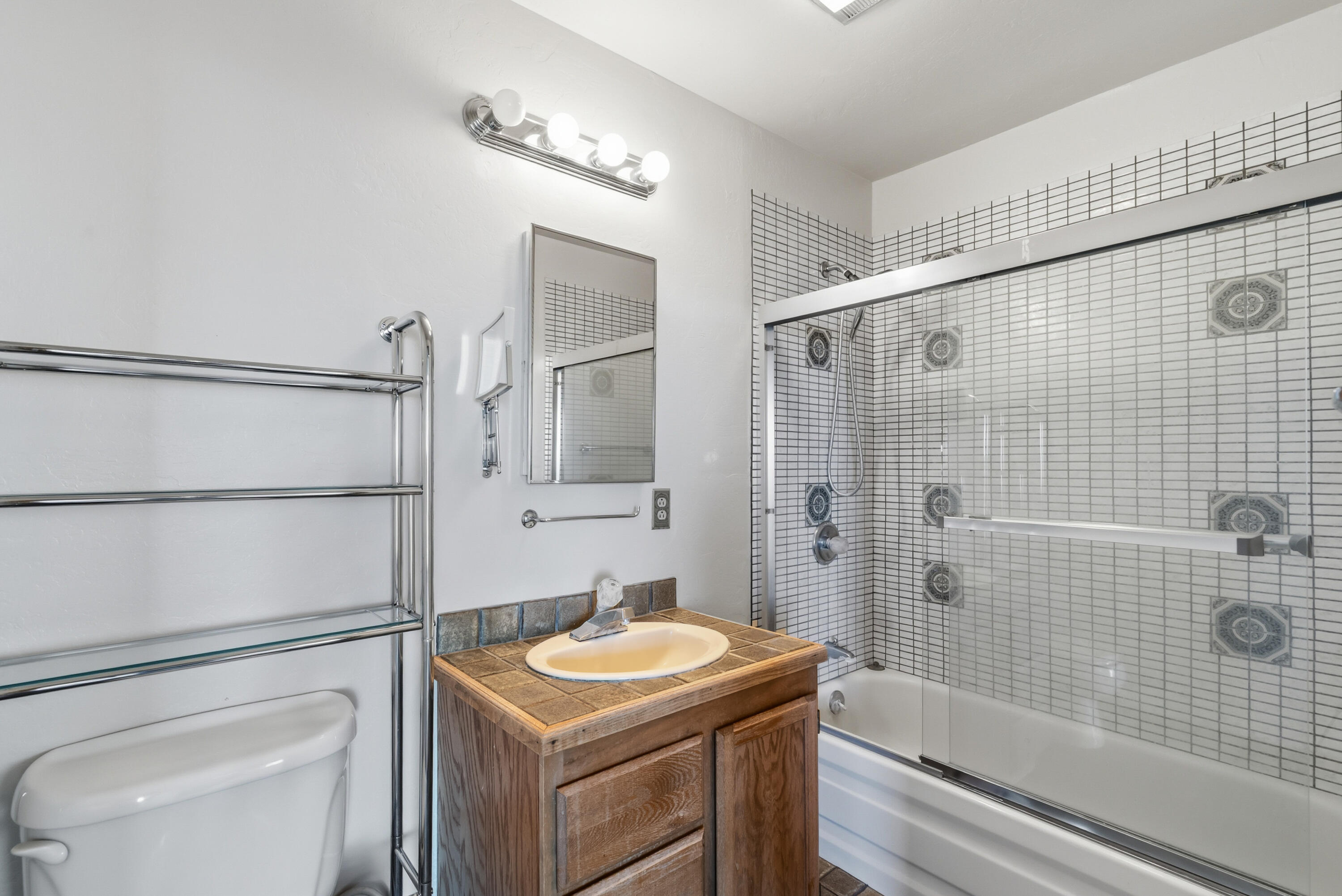 6866 Alpine Ridge Road Shingletown, CA 96088 - Photo 34 of 58 a bathroom with a sink a toilet and shower