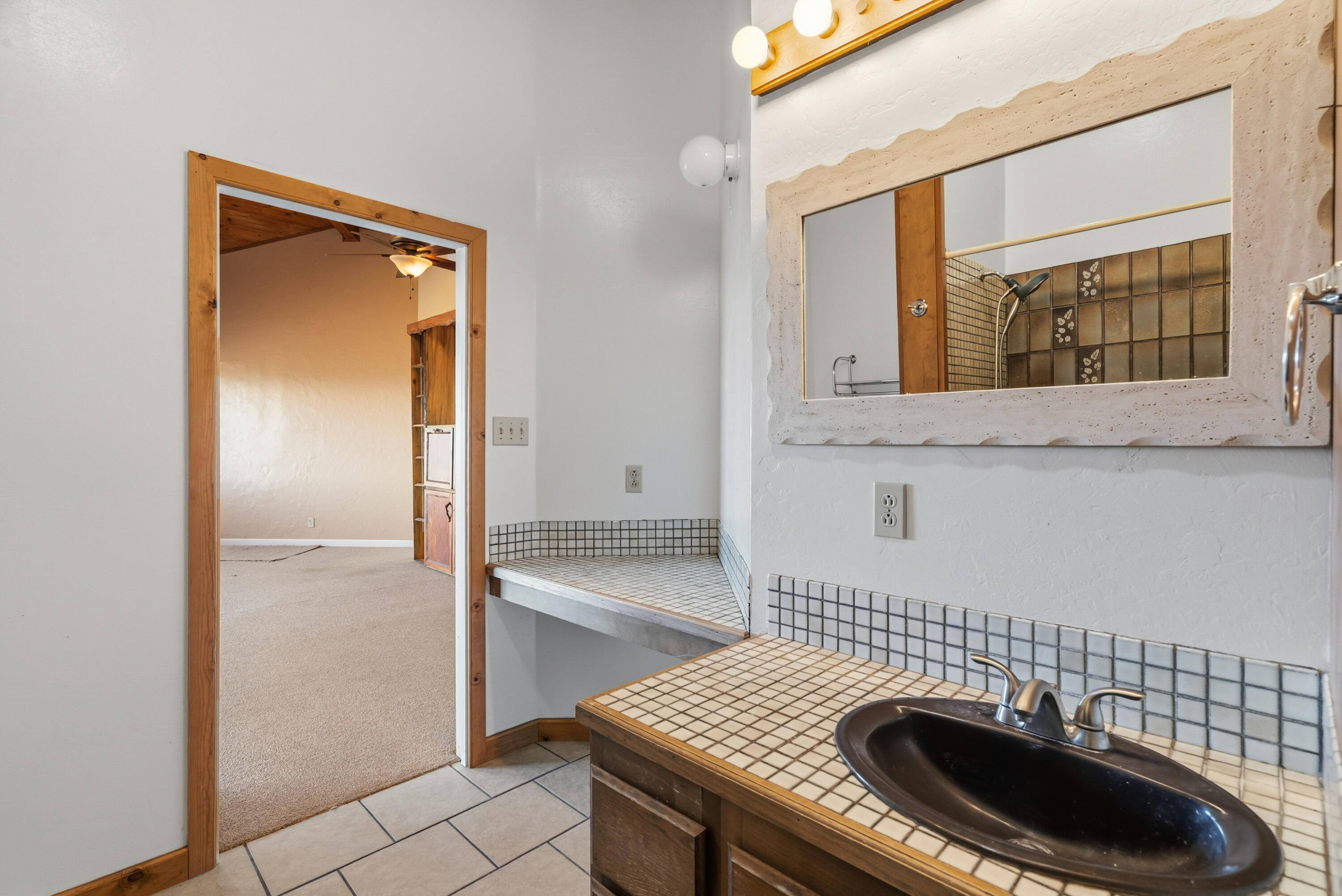 6866 Alpine Ridge Road Shingletown, CA 96088 - Photo 38 of 58 a bathroom with a sink and a mirror