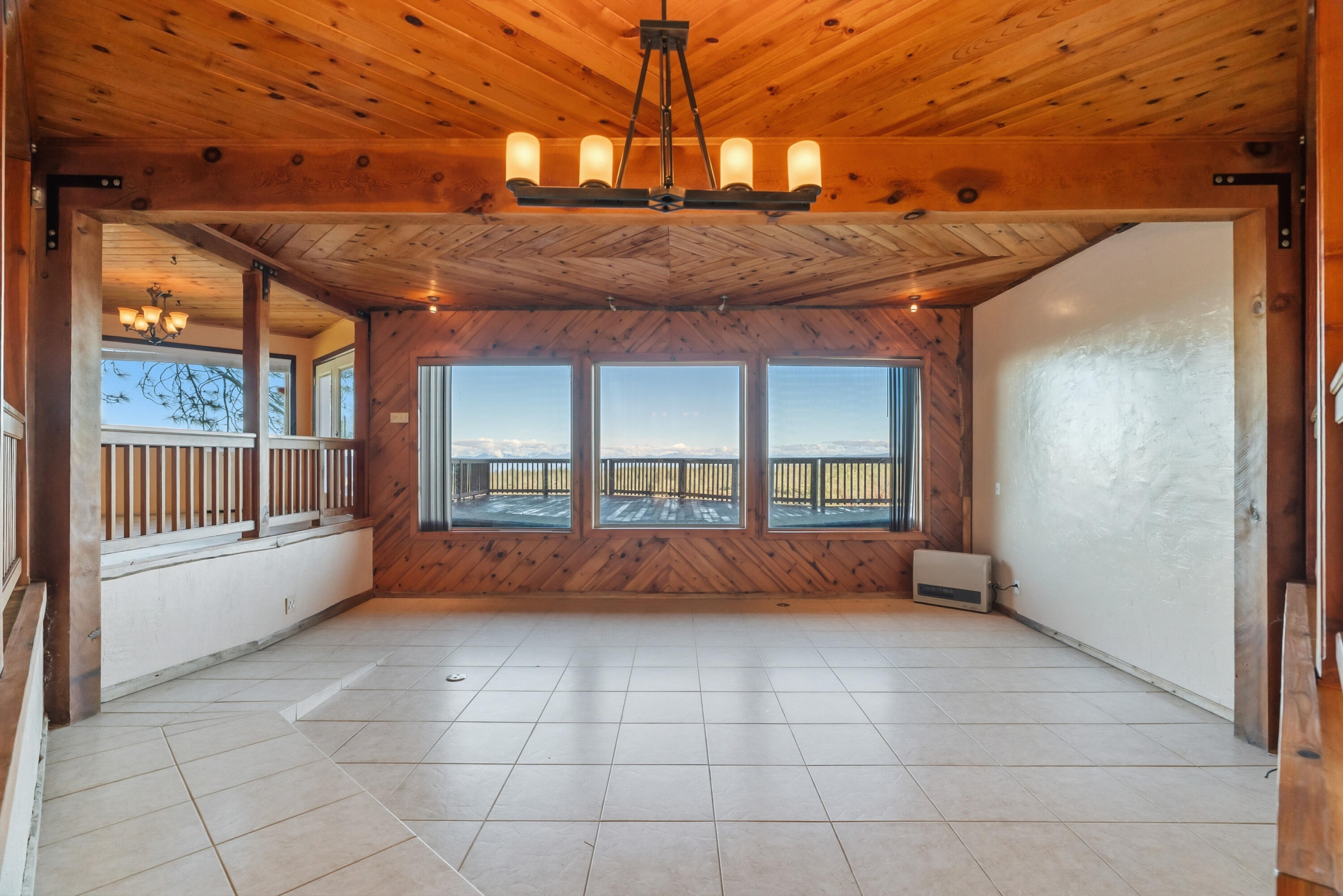 6866 Alpine Ridge Road Shingletown, CA 96088 - Photo 4 of 58 a view of an empty room with a window