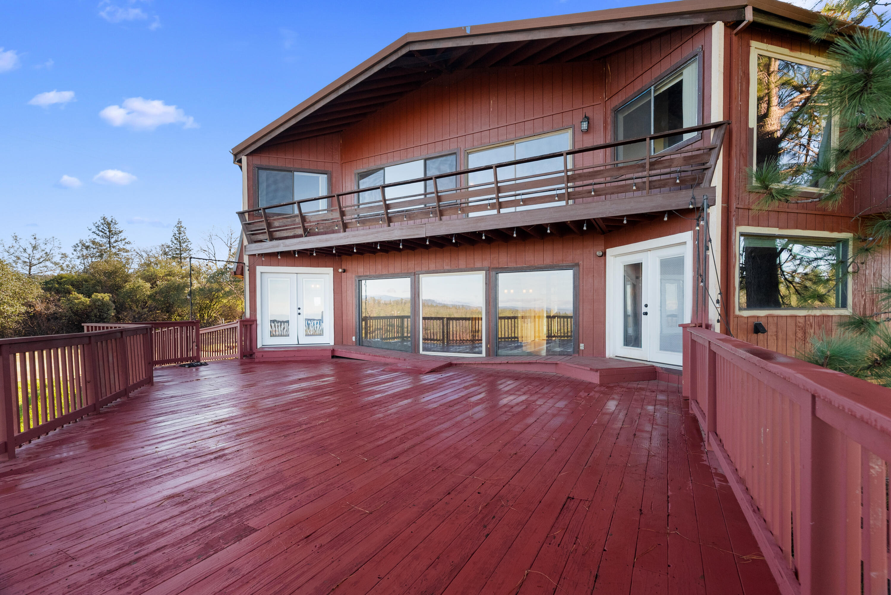 6866 Alpine Ridge Road Shingletown, CA 96088 - Photo 44 of 58 a view of a house with wooden floor and fence
