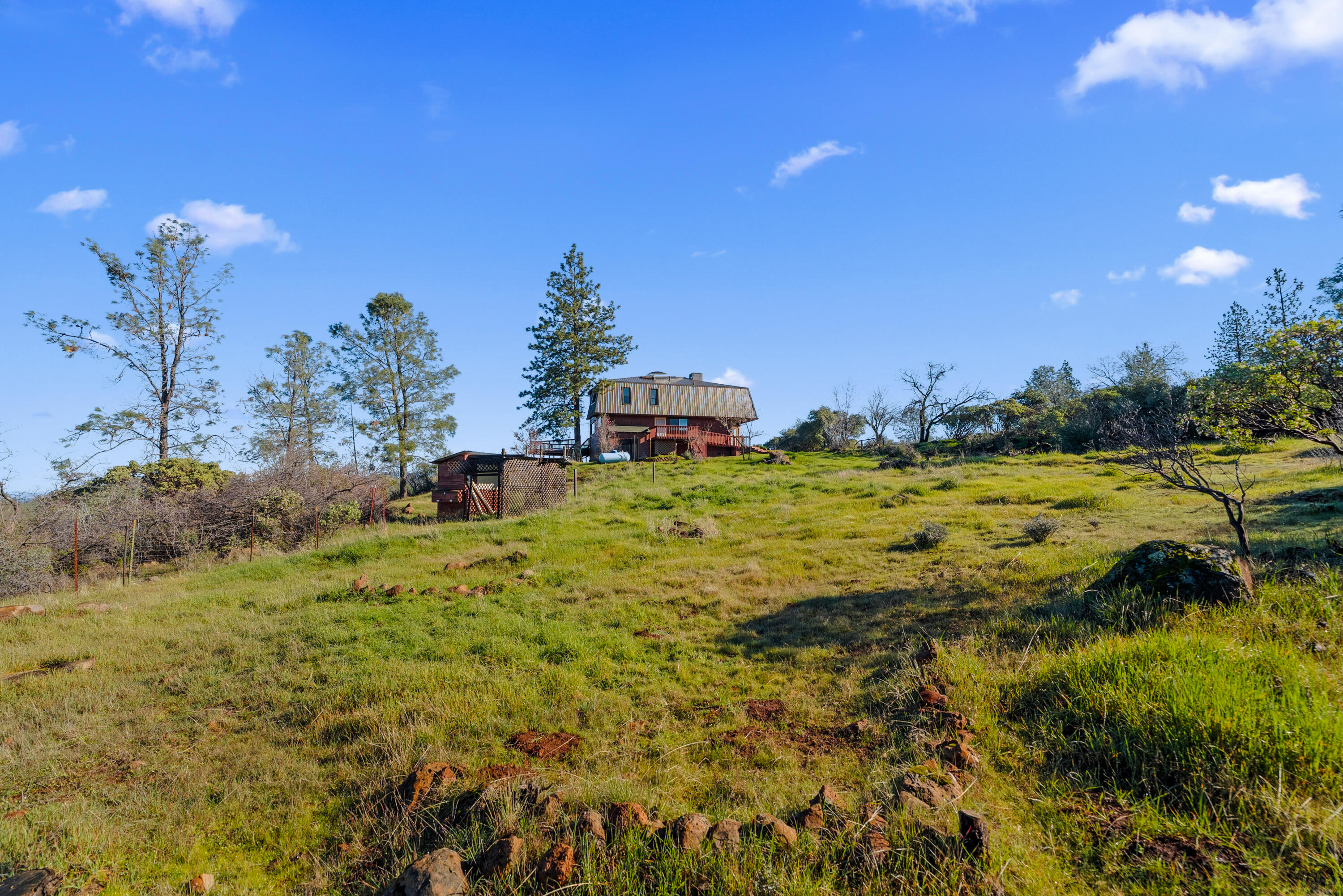 6866 Alpine Ridge Road Shingletown, CA 96088 - Photo 54 of 58 a backyard of a house with a yard and outdoor seating