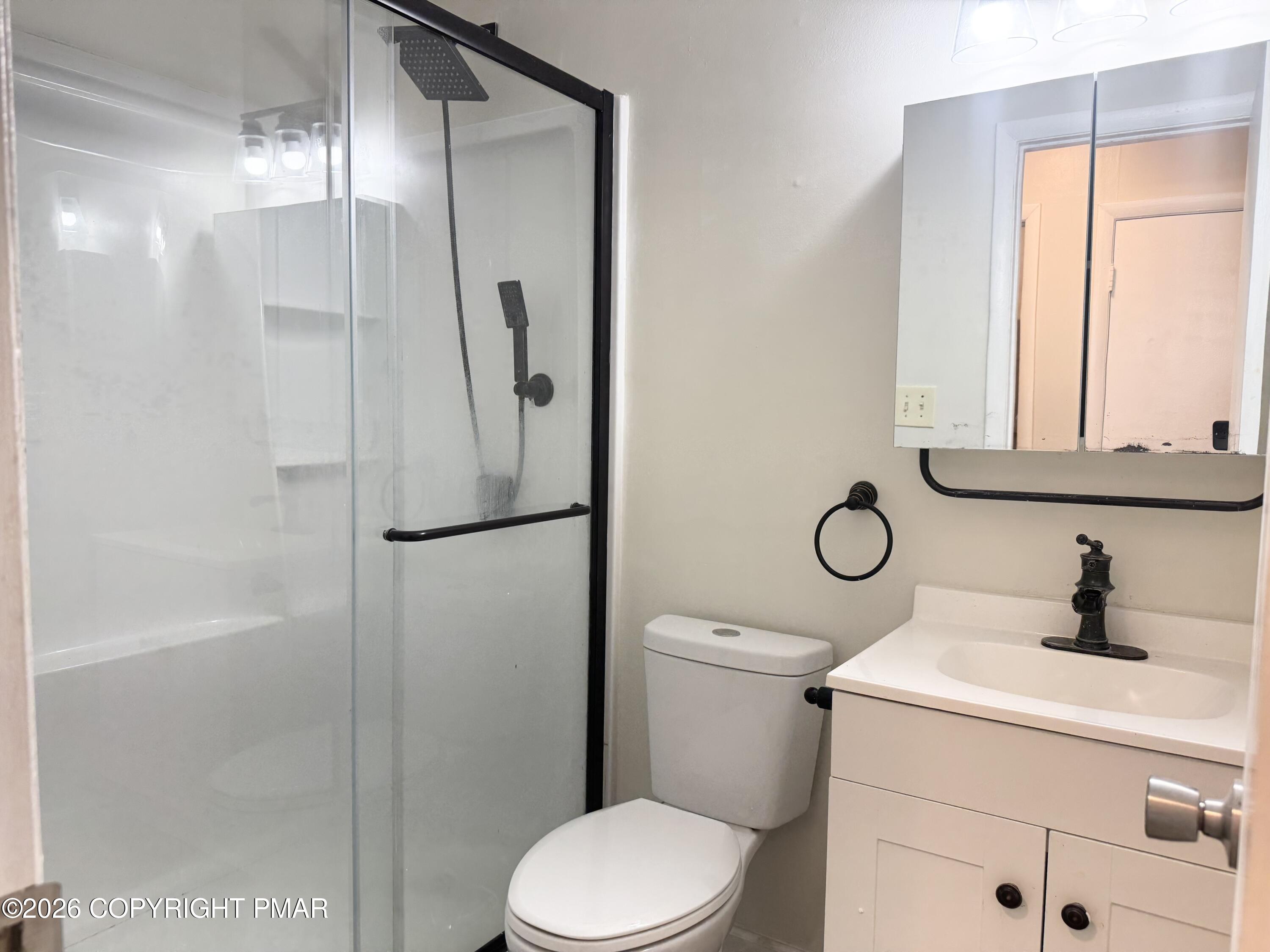 130 View Court, Unit 101 Mount Pocono, PA 18344 - Photo 12 of 17 a bathroom with a toilet sink vanity and shower